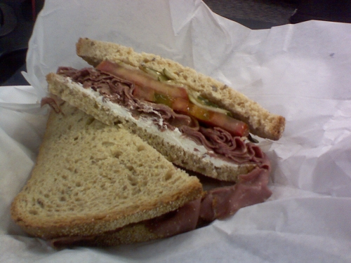 "The Piaf" sandwich from Klein's Deli.  Features roast beef, cream cheese, horseradish, dill pickle, and tomatoes on light rye.